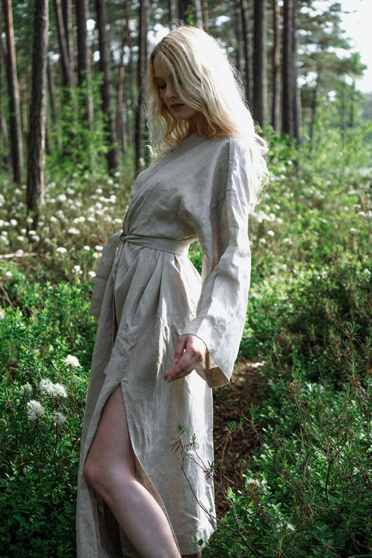 Organic, sustainable and sexy at the same time! Agasåga long beige kimono with splits, long sleeves and belt. Below knee length bathrobe. This robe is natural, soft, breathable and pure. It’s a conscious and healthy choice for your body and environment that embraces genuine selflove and selfcare. Handmade with love in the North.