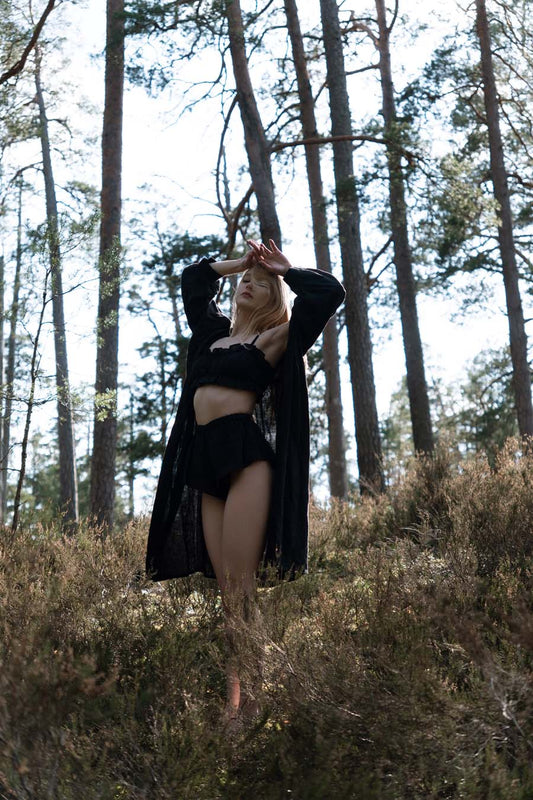 Organic, sustainable and sexy at the same time! Agasåga set of a black cute bralette with frills, little shorts with high waist and an oversized coat/robe dress with fluffy 3/4 sleeves. These garments are natural, soft, breathable and pure. It’s a conscious and healthy choice for your body and environment that embraces genuine selflove and selfcare. Handmade with love in the North.