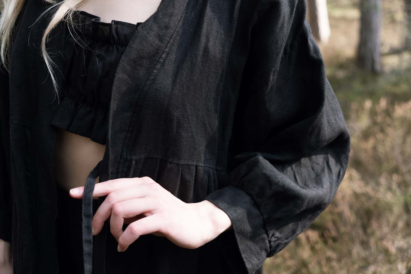 Organic, sustainable and sexy at the same time! Agasåga set of a black cute bralette with frills, little shorts with high waist and an oversized coat/robe dress with fluffy 3/4 sleeves. These garments are natural, soft, breathable and pure. It’s a conscious and healthy choice for your body and environment that embraces genuine selflove and selfcare. Handmade with love in the North.