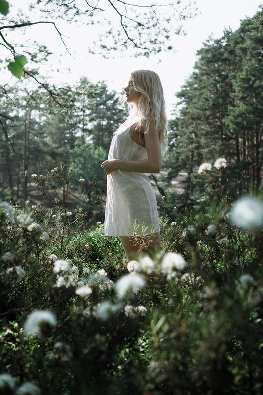 Organic, sustainable and sexy at the same time! Agasåga white short natural linen slip dress, nightdress with straps. This sleepwear is natural, soft, breathable and pure. It’s a conscious and healthy choice for your body and environment that embraces genuine selflove and selfcare. Handmade with love in the North.