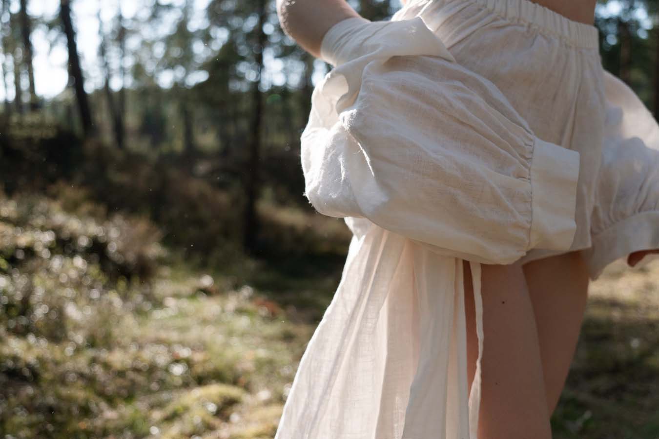 Organic, sustainable and sexy at the same time! Agasåga set of a white cute bralette with frills, little shorts with high waist and an oversized coat/robe dress with fluffy 3/4 sleeves. These garments are natural, soft, breathable and pure. It’s a conscious and healthy choice for your body and environment that embraces genuine selflove and selfcare. Handmade with love in the North.