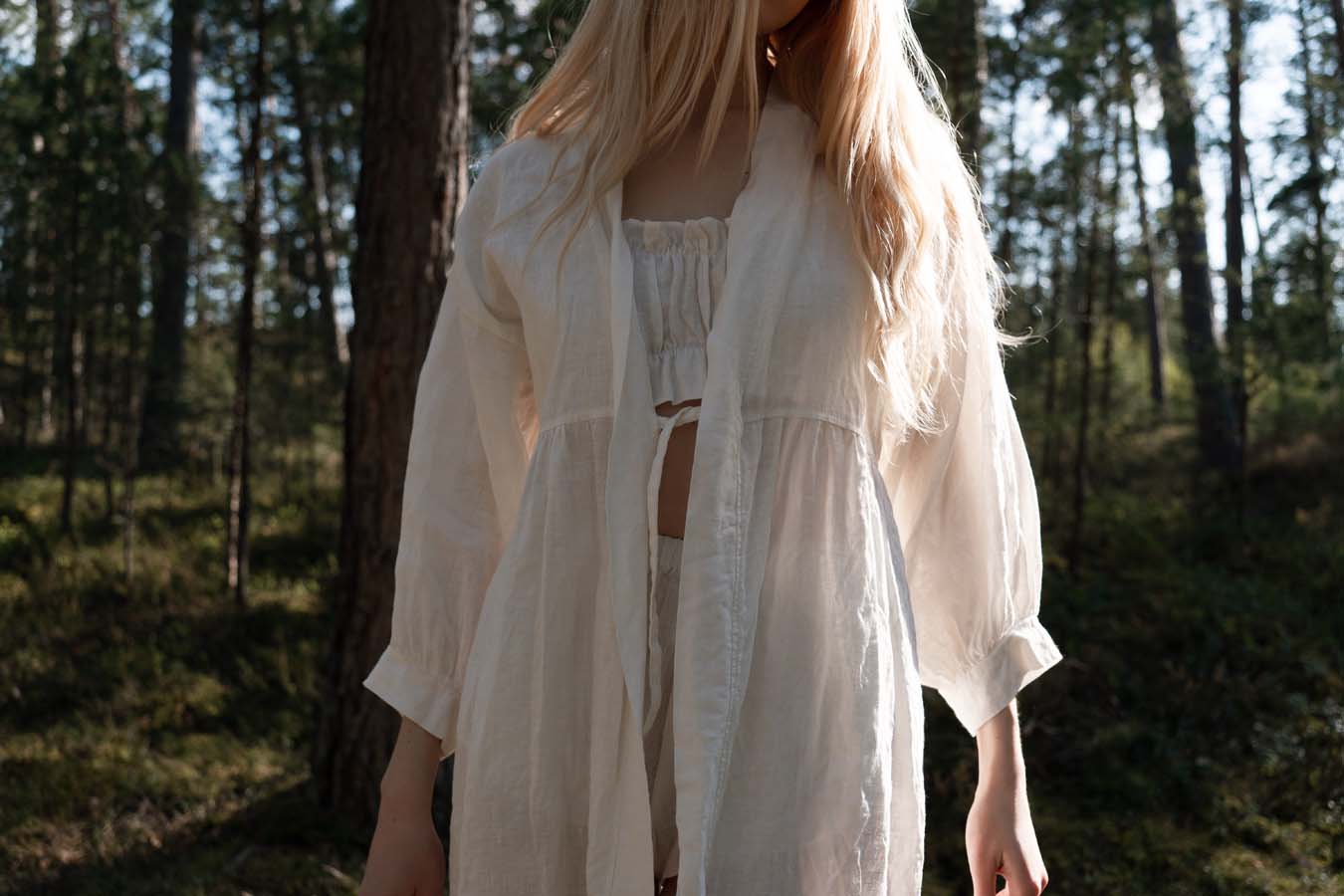 Organic, sustainable and sexy at the same time! Agasåga set of a white cute bralette with frills, little shorts with high waist and an oversized coat/robe dress with fluffy 3/4 sleeves. These garments are natural, soft, breathable and pure. It’s a conscious and healthy choice for your body and environment that embraces genuine selflove and selfcare. Handmade with love in the North.