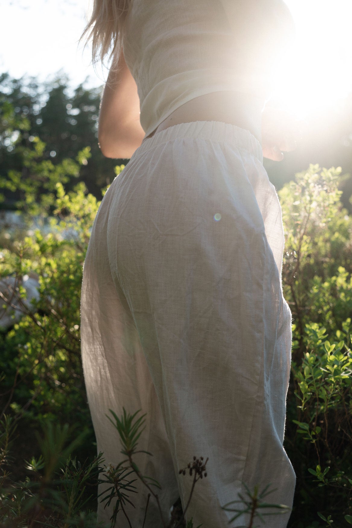 Organic, sustainable white linen pants and top that can be worn as a loungewear, pajamas or sweatpants with a top. These pants are natural, comfortable, soft and pure. These pants are a conscious and healthy choice for your body and environment. Handmade in the North.
