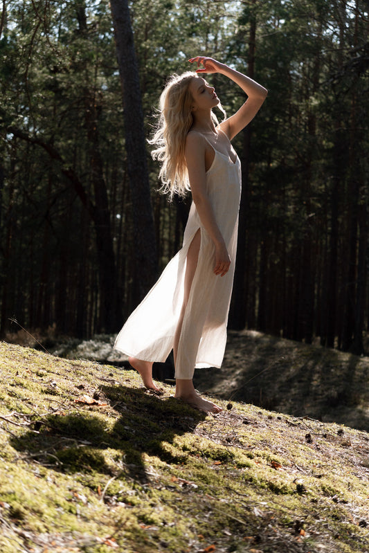 Organic, sustainable, sexy, long white linen nightwear slip dress with spaghetti straps and splits. This linen lingerie nightdress is natural, comfortable, soft and pure. This sleepwear nightgown is a conscious and healthy choice for your body and environment.