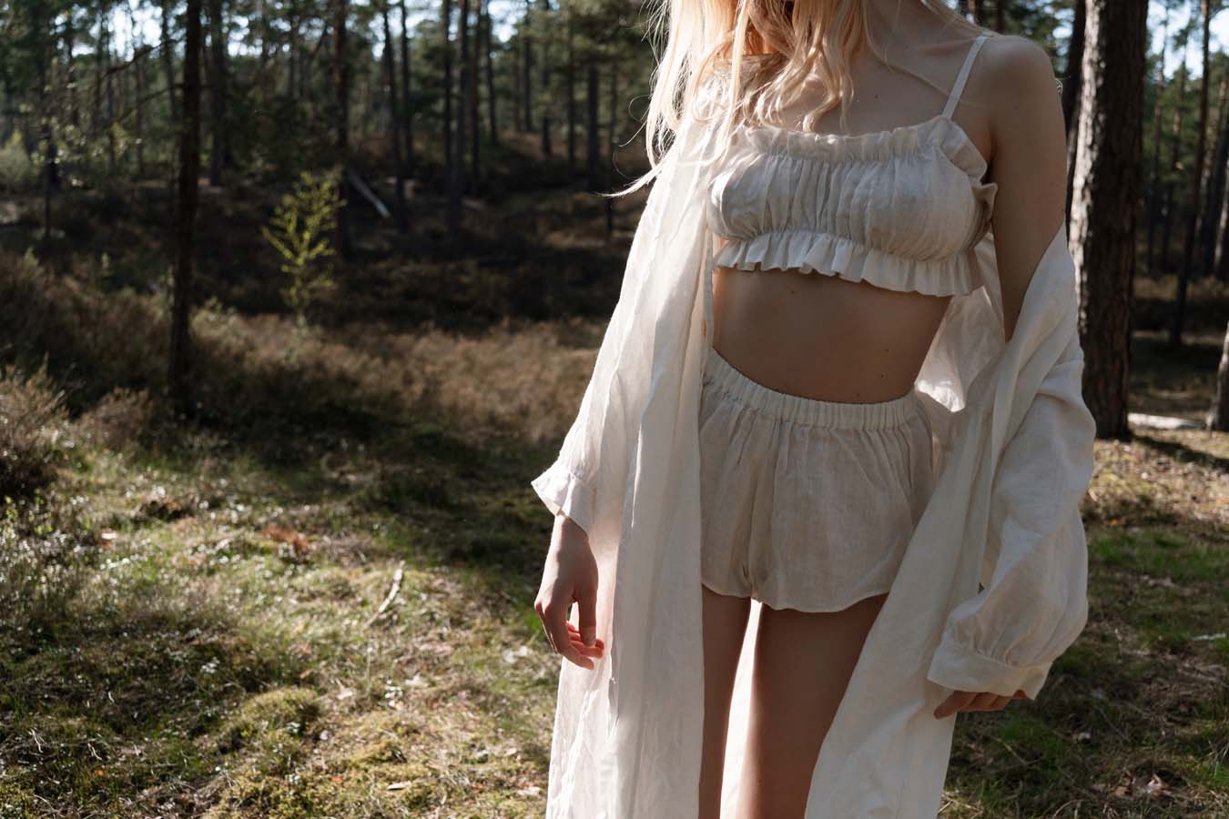 Organic, sustainable and sexy at the same time! Agasåga set of a white cute bralette with frills, little shorts with high waist and an oversized coat/robe dress with fluffy 3/4 sleeves. These garments are natural, soft, breathable and pure. It’s a conscious and healthy choice for your body and environment that embraces genuine selflove and selfcare. Handmade with love in the North.