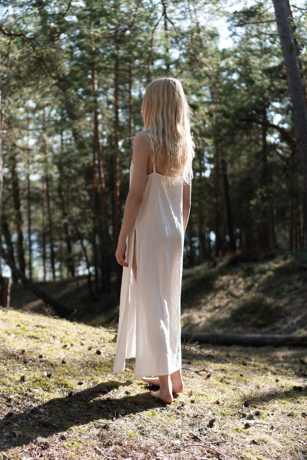 Organic, sustainable, sexy, long white linen nightwear slip dress with spaghetti straps and splits. This linen lingerie nightdress is natural, comfortable, soft and pure. This sleepwear nightgown is a conscious and healthy choice for your body and environment.